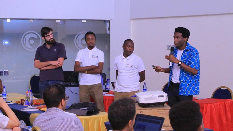 Student founders of JUAMI-OCF lead a presentation