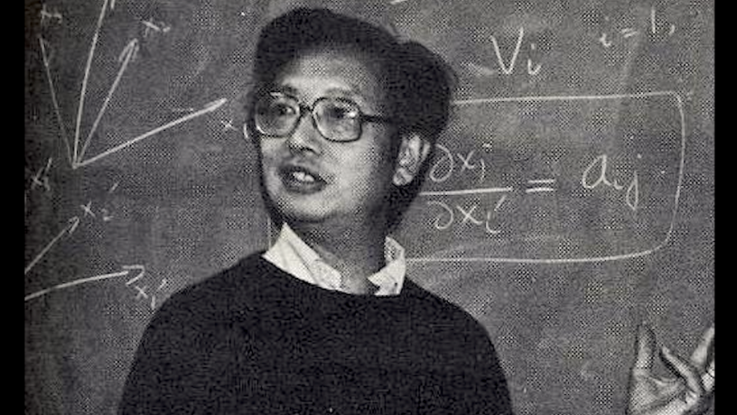 Photo of Prof. C.K. Chu teaching math at a blackboard in 1980