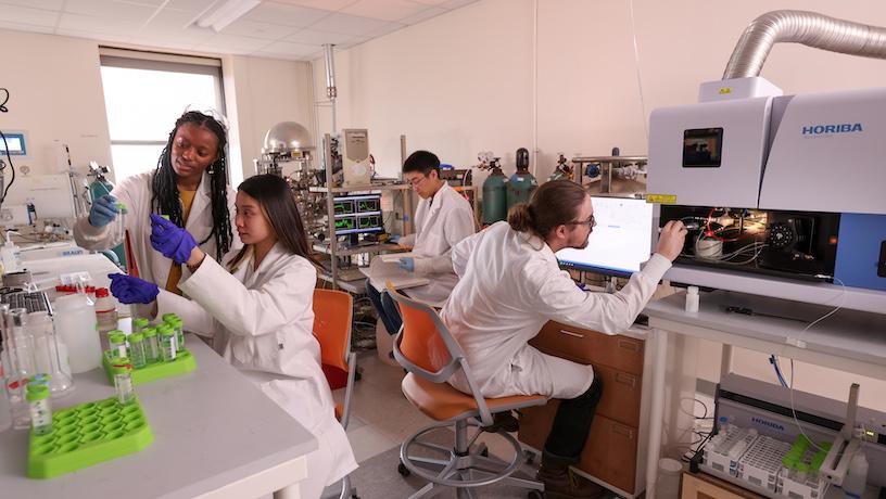 Graduate students working in a CEEC shared lab