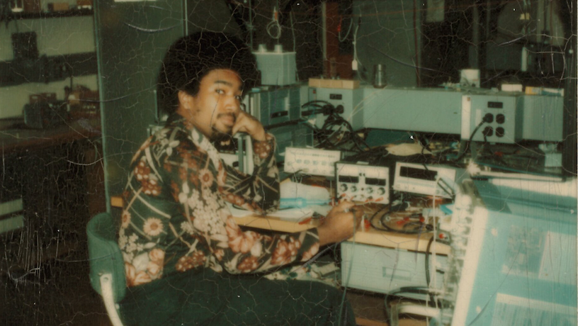 Lanny Smoot sitting at a table with electronic equipment.