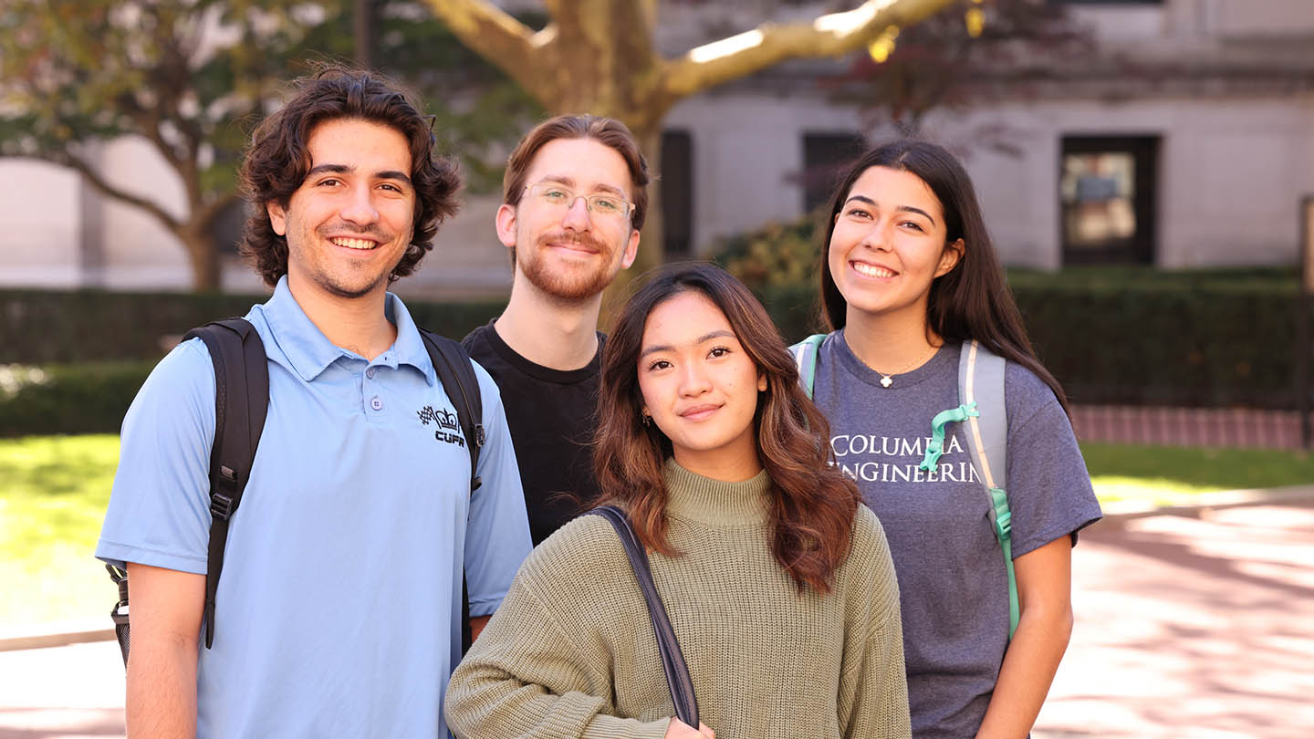 A group of four Columbia Engineering students smiling at the camera.