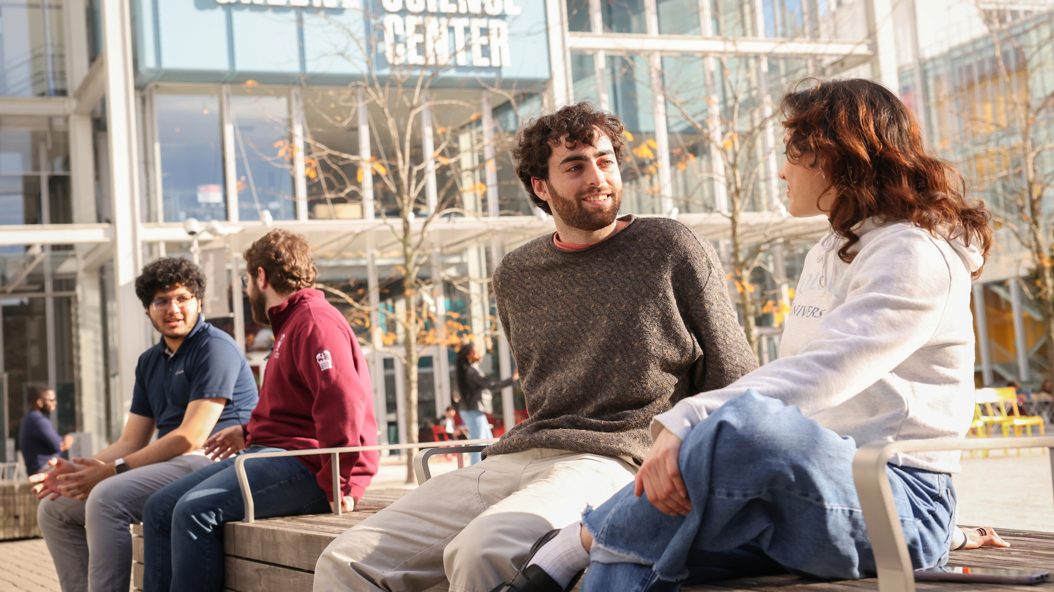 Graduate students sit outside the Science Center at Columbia Engineering.