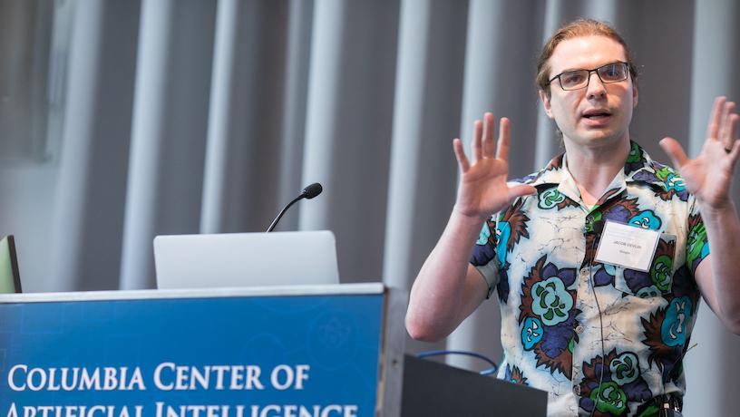 Google research scientist Jacob Delvin speaking at the second annual CAIT symposium