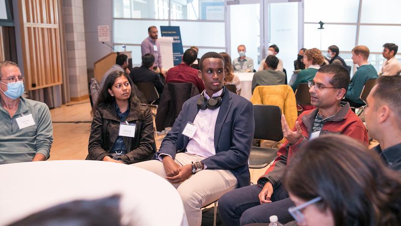 2022 CAIT symposium attendees speaking at a round table