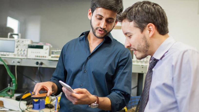 students discuss wearable device