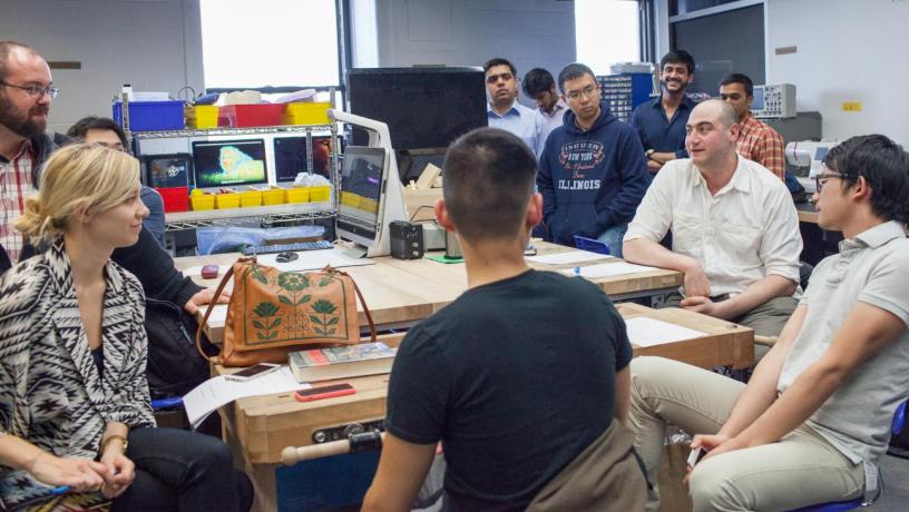 students and judges discuss engineering challenge