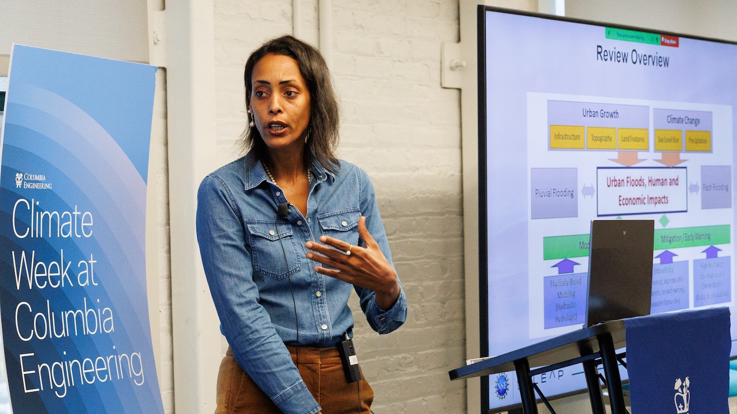 A presenter speaking to an audience.