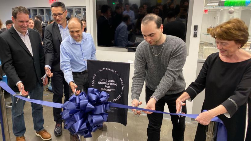 Faculty members ceremonial ribbon cutting.