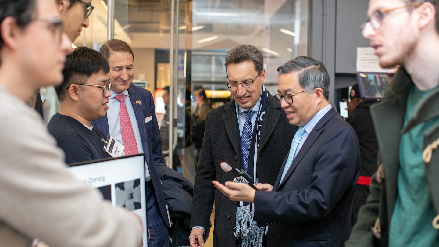 Dean Shih-Fu Chang (foreground) with University Trustees Keith Goggin and Victor Mendelson