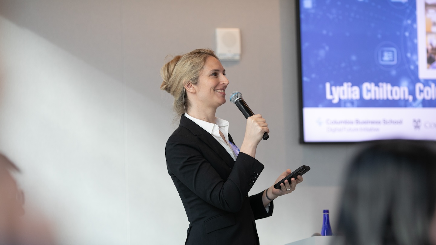 Lydia Chilton holding a microphone