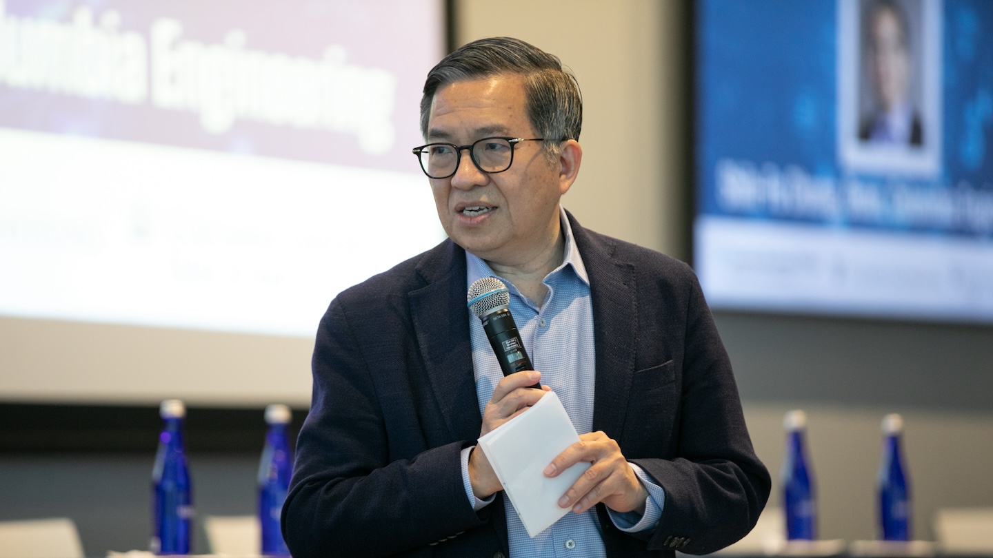 Shih-Fu Chang holding a microphone at the AI Agents for Work event