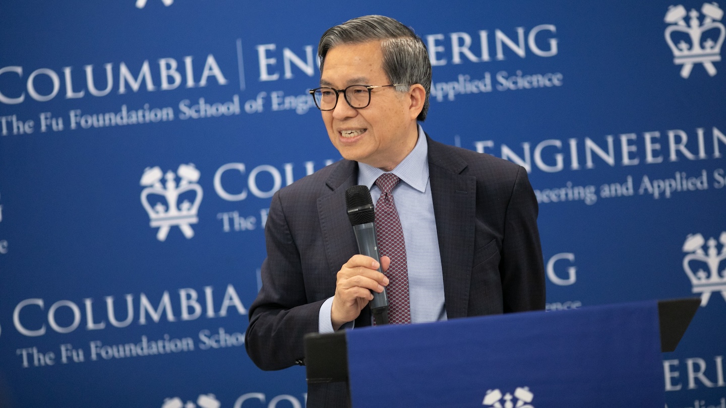Shihi-Fu Chang holding a microphone in front of a Columbia Engineering-themed backdrop.