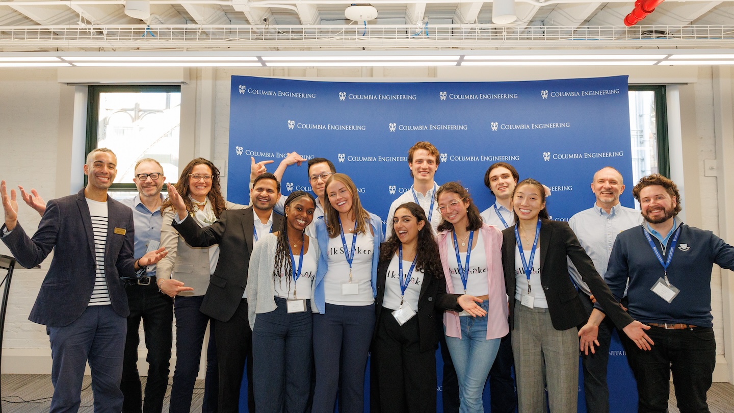 14 Millard Chan Tech Challenge 2025 winners and advisors pose for a photo in front of a Columbia Engineering backdrop