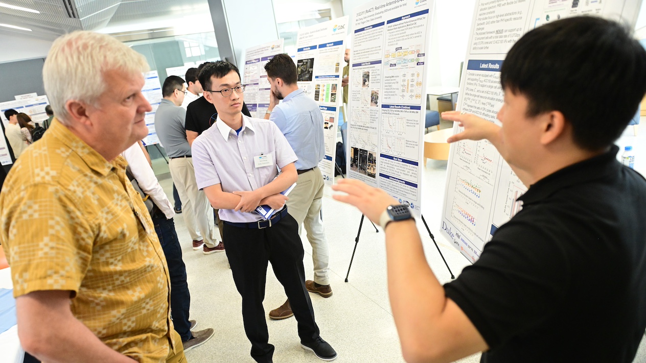 researchers and scholars discussing research findings
