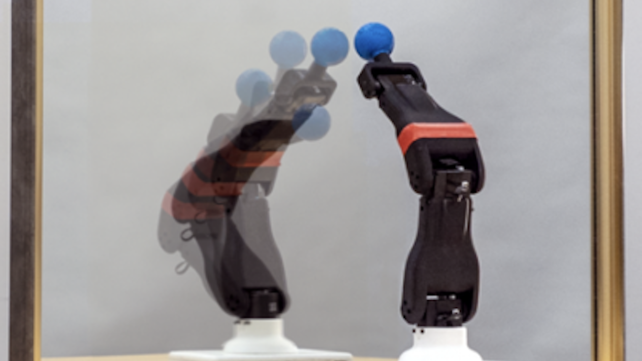 A robot observes its reflection in a mirror, learning its own morphology and kinematics for autonomous self-simulation