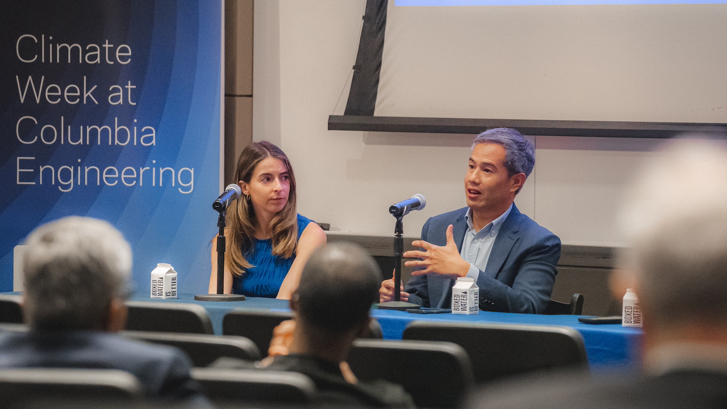 2 speakers addressing an audience at climate week