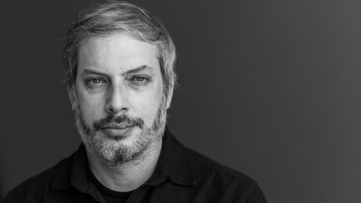 black and white headshot of Ethan Katz-Bassett, associate professor of electrical engineering