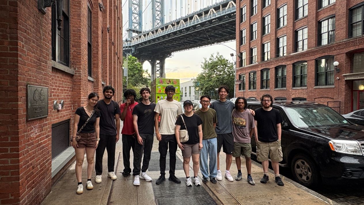 group of students standing in front of popular nyc tourist location in dumbo