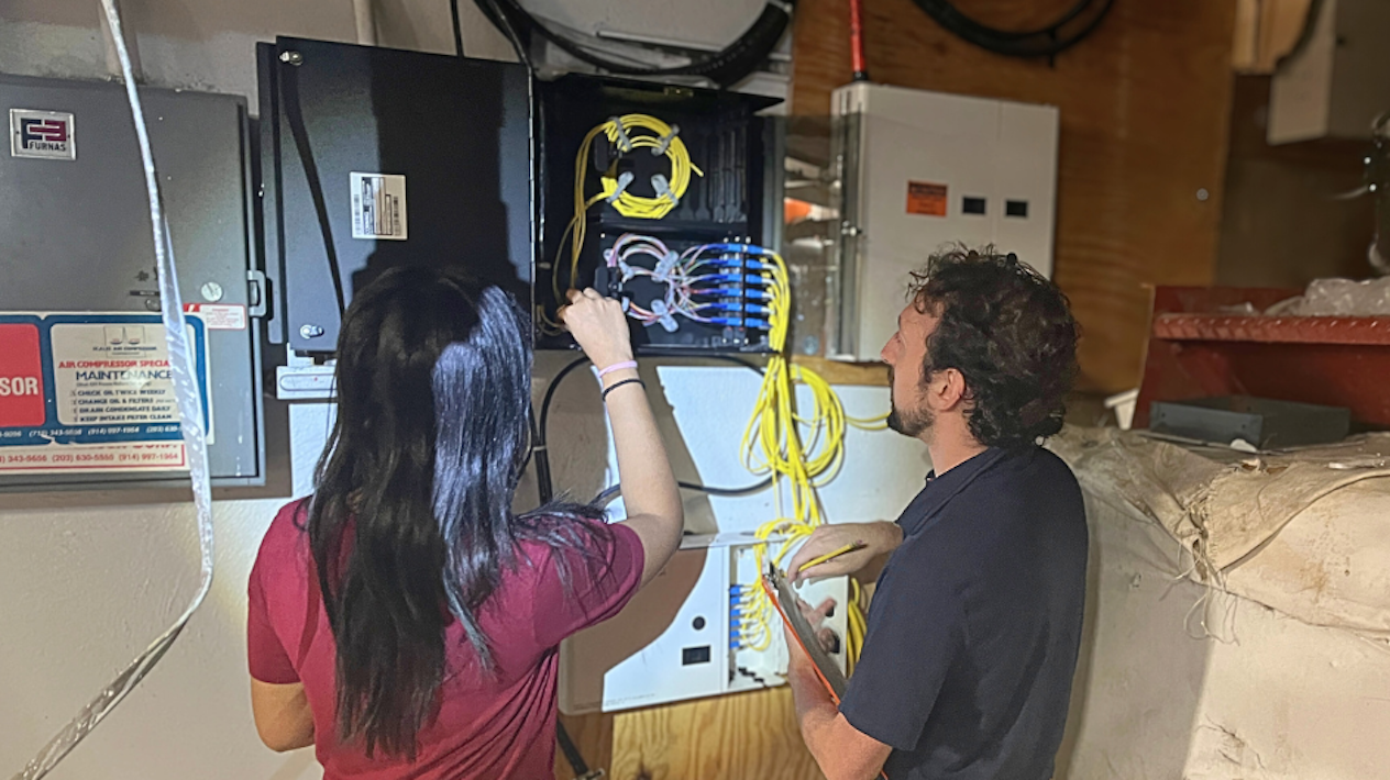Shivalee Shah, MS student in Quantum Science and Technology, and John Drogo, Electrical Engineering PhD student, worked with CUIT and Crown Castle on the fiber connection to Brooklyn