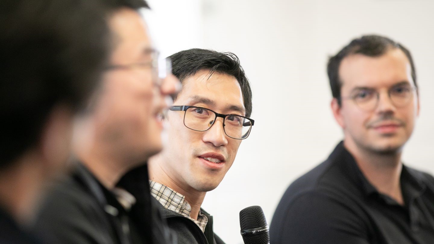 close up photo of 3 speakers at the panel