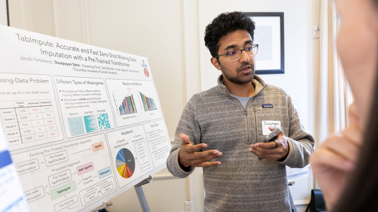 presenter discussing research to audience member