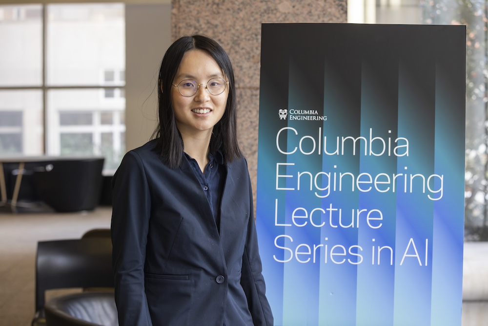 danqi chen standing in front of banner that reads "columbia engineering lecture series in AI"