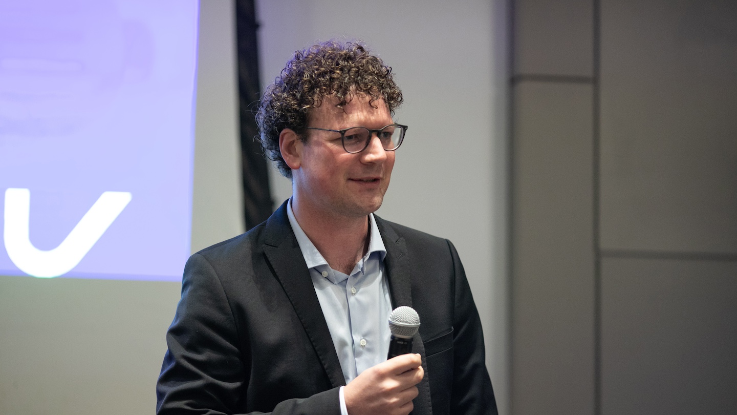 Matthias Preindl, associate professor of electrical engineering and director of the Columbia Center for Advanced Electrification, addresses the symposium audience.