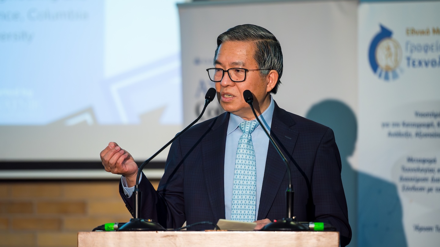 dean shih fu chang speaking at podium