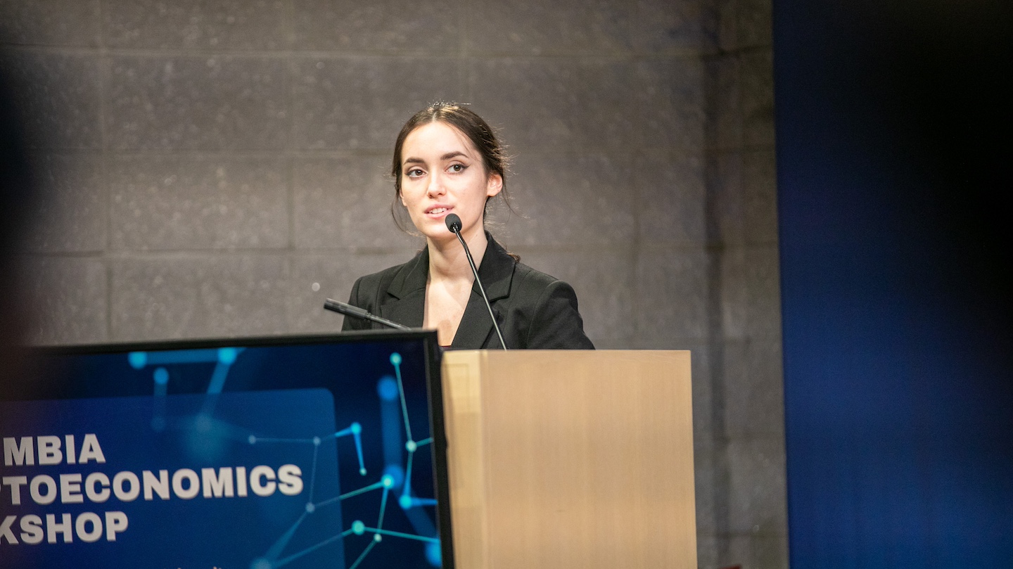 speaker at podium for Columbia CryptoEconomics Workshop