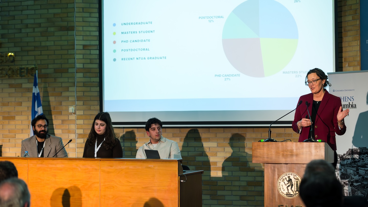 3 panelists and a speaker at a podium