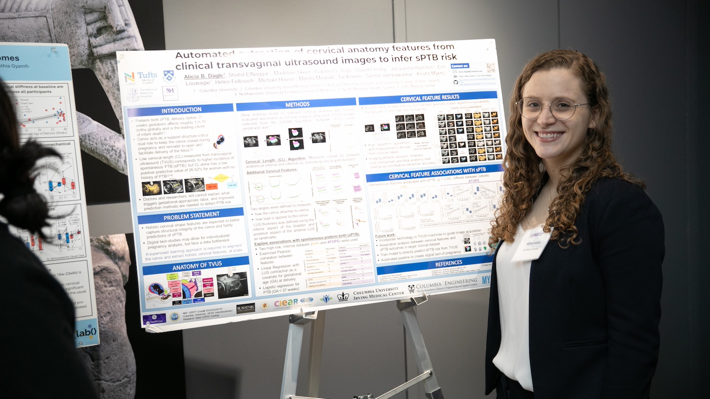 researcher next to their research poster about women's health
