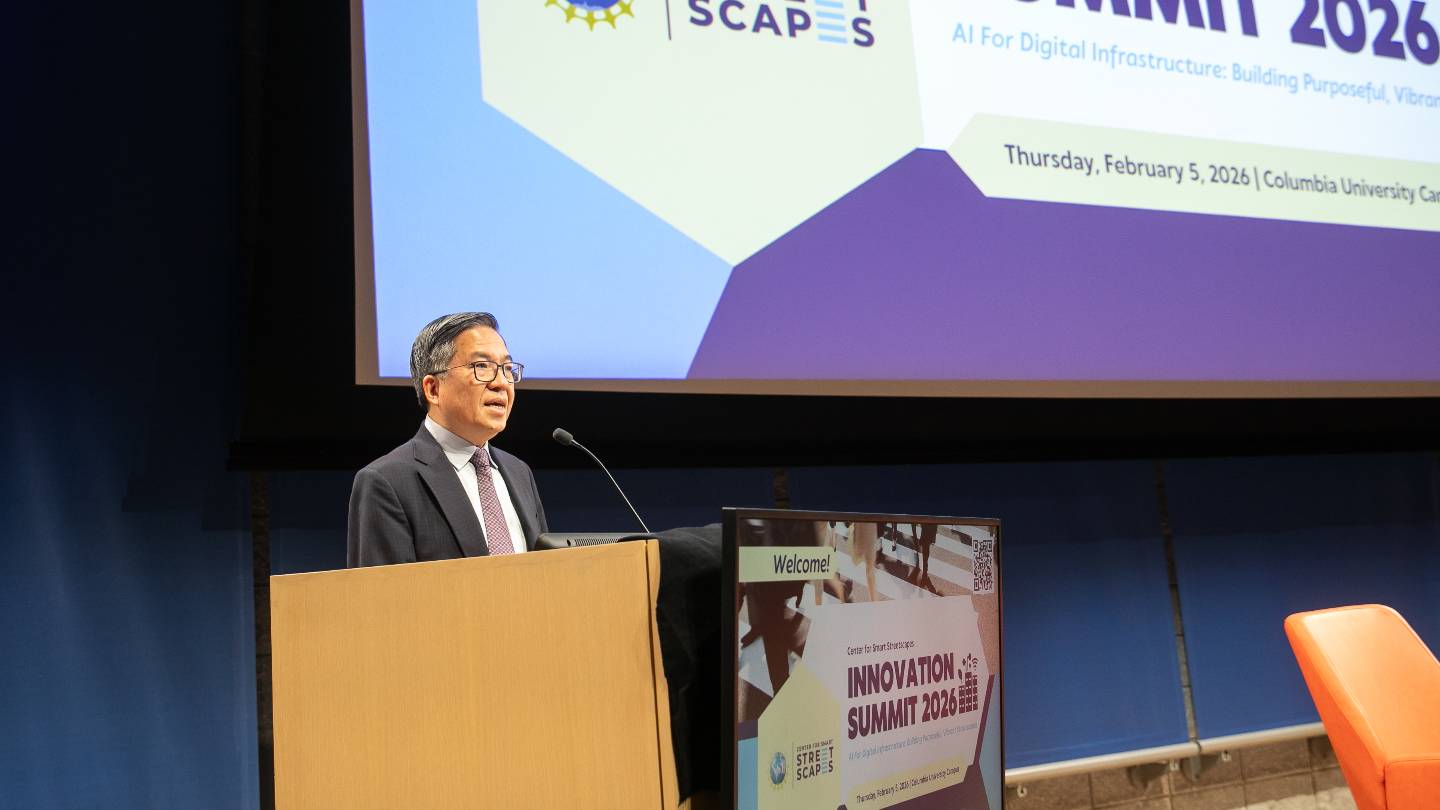 Columbia Engineering Dean Shih-Fu Chang standing behind a podium on a stage