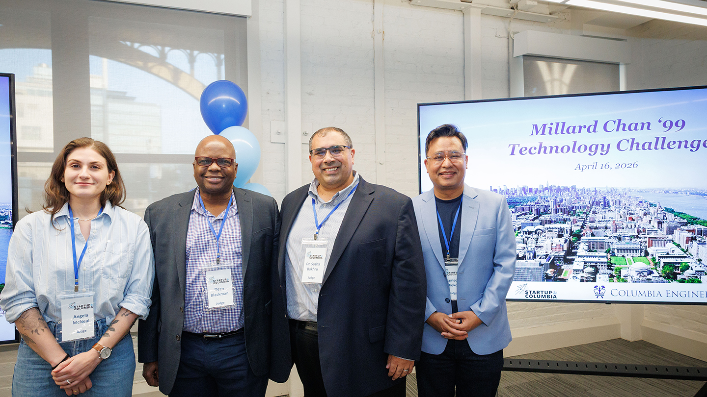 Group photo of four attendees/judges in front of the event screen (Millard Chan ’99 Technology Challenge; Columbia Engineering/Startup Columbia branding visible).