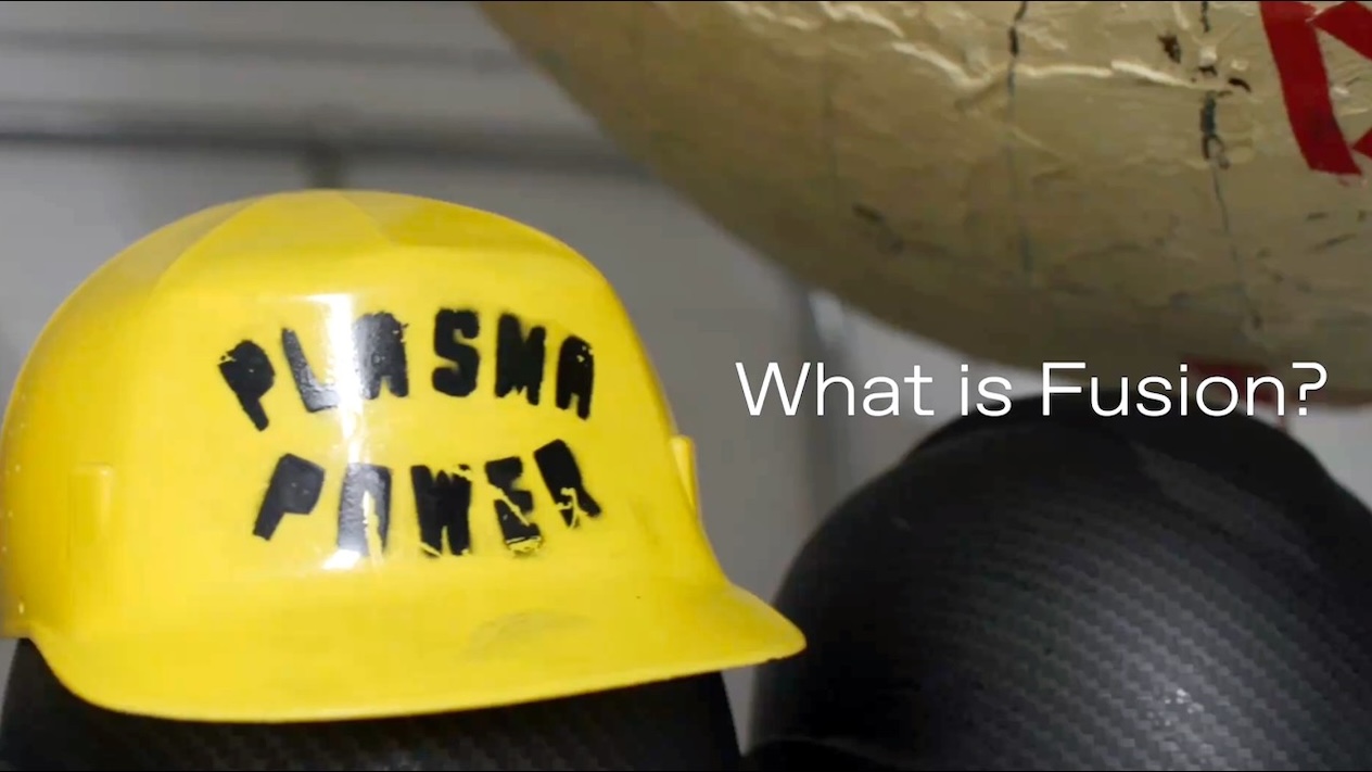 A yellow hardhat with the words "Plasma Power" printed on it. Words overlay the photo reading "What is Fusion?"