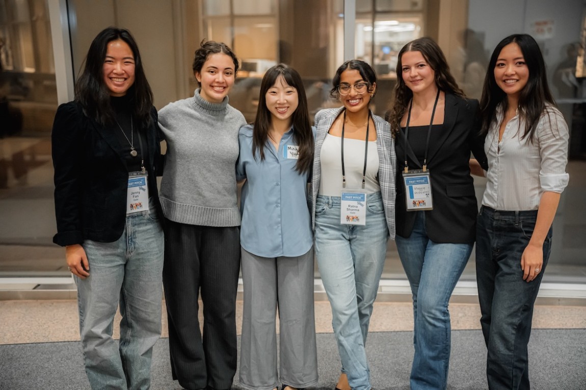Six people smiling for a photo.