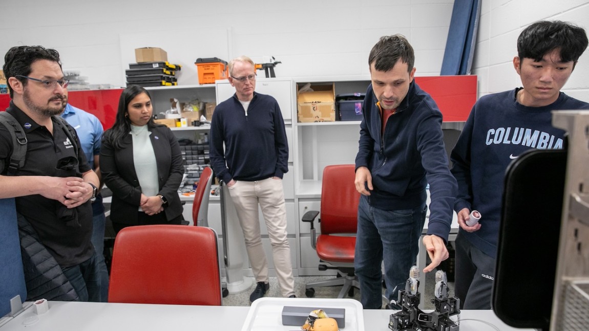 David Limp meets with members of the Robotic Manipulation and Mobility Lab, directed by Mechanical Engineering Associate Professor Matei Ciocarlie (foreground).