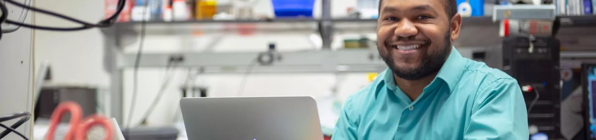 Micheal Sutton sitting in a lab in front of a computer