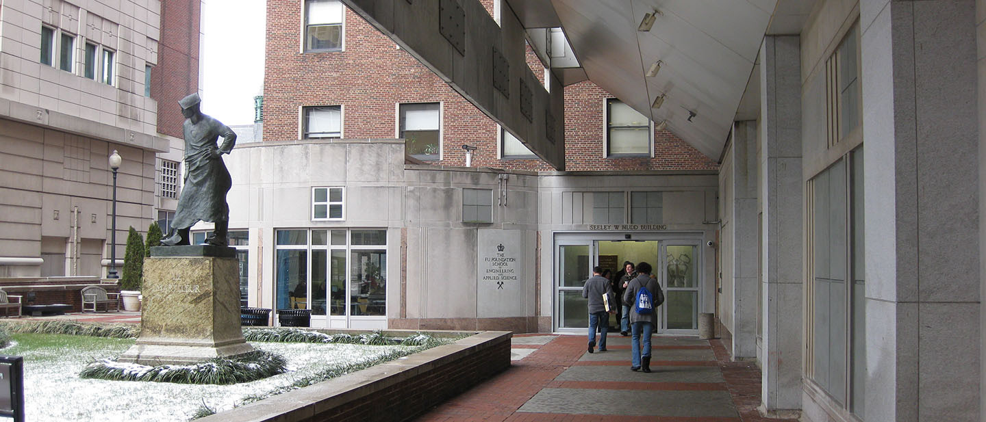 Students walking toward a dining hall on Columbia University's campus.
