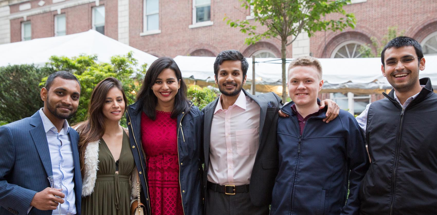Columbia Engineering graduate students pose for a photo outdoors.