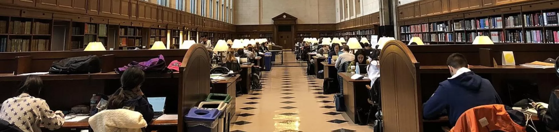 Students working in a large library at Columbia University.