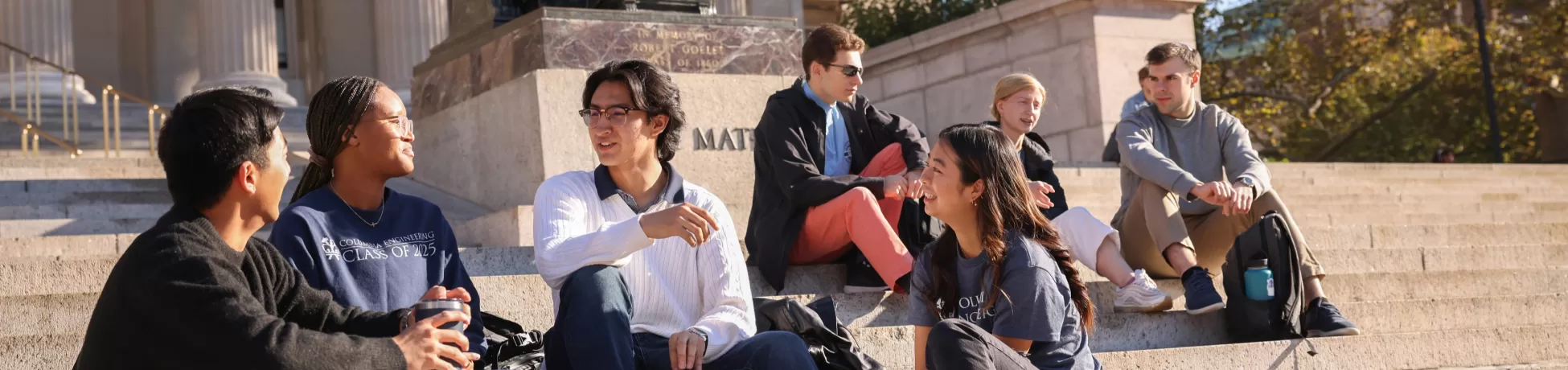Columbia Engineering alumni meet with current students on the steps of Lowe library.