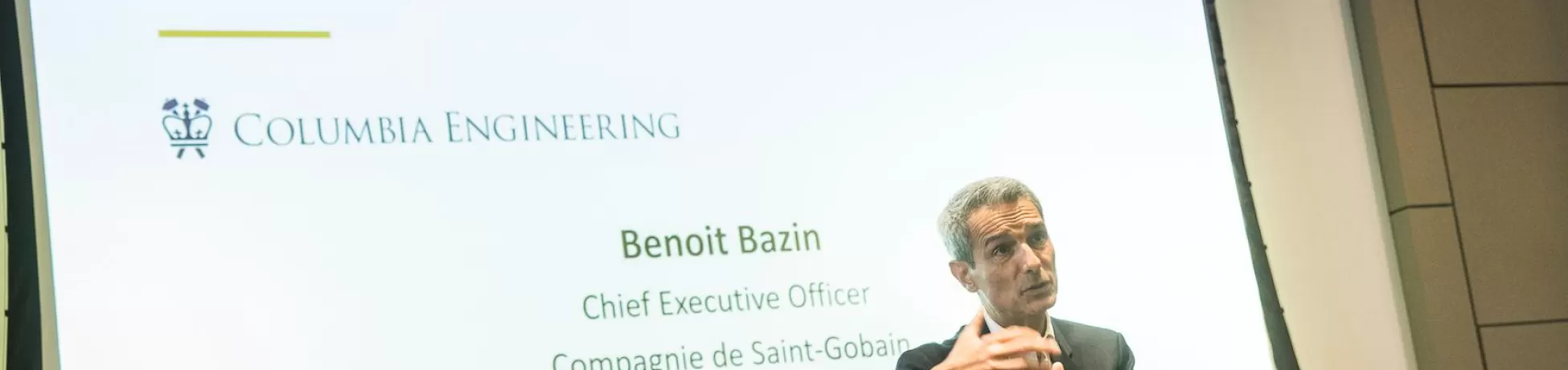 An image of a CEO giving a lecture in front of an audience