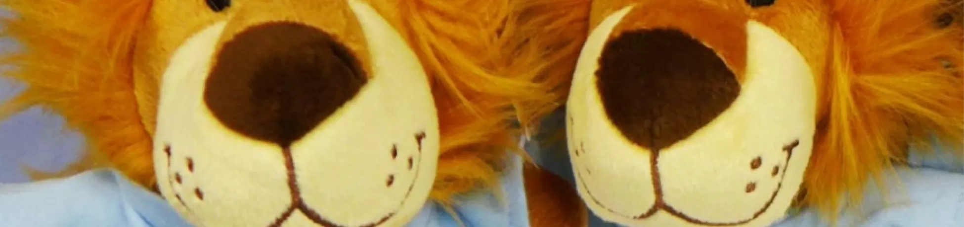 Two stuffed lion toys from the Office of Work/Life at Columbia University