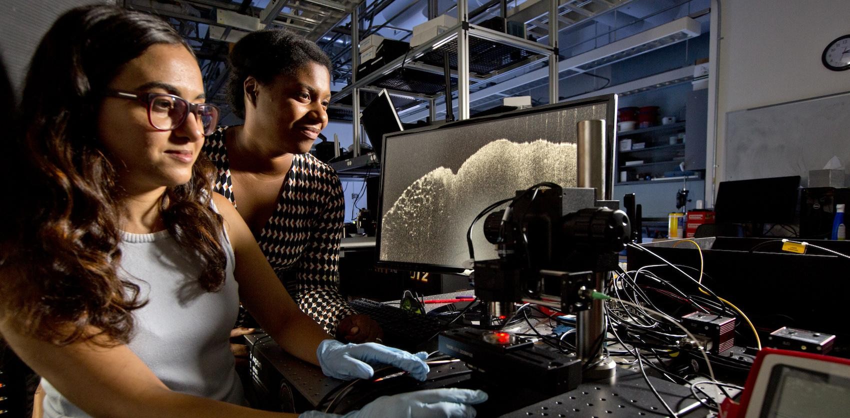 Two Women looking at Medical Imaging Systems