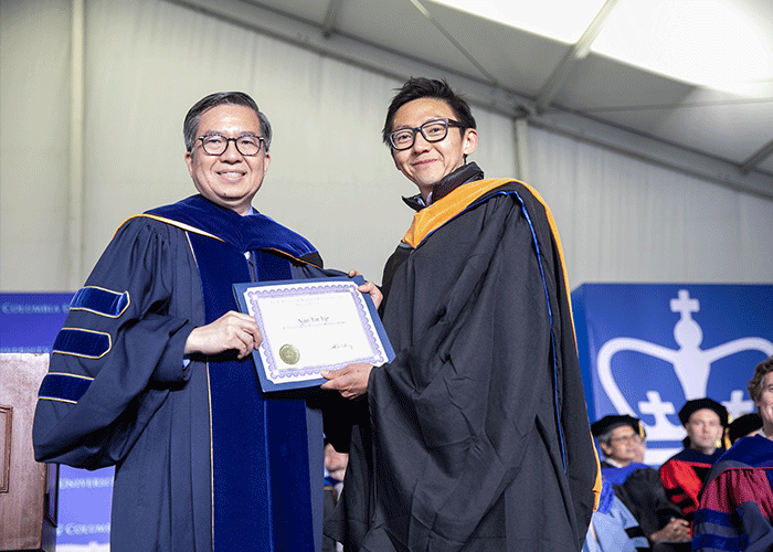 David Yao and Columbia Engineering Dean Shih-Fu Chang holding a certificate on stage