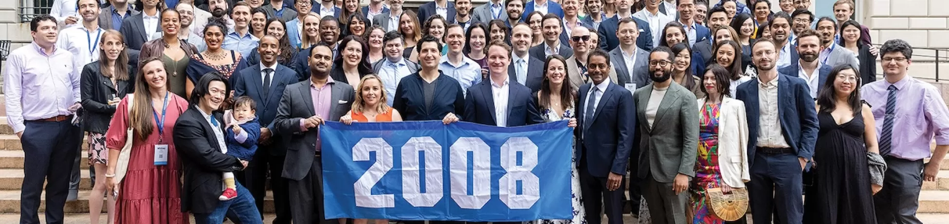 Reid Ellison poses with members of his graduating class during reunion
