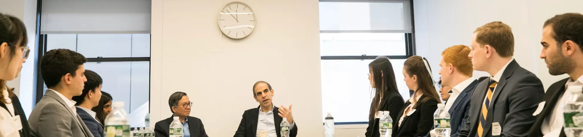 Armen Avenessians and Dean Shih-Fu Chang sit at the head of the table with Columbia Engineering students
