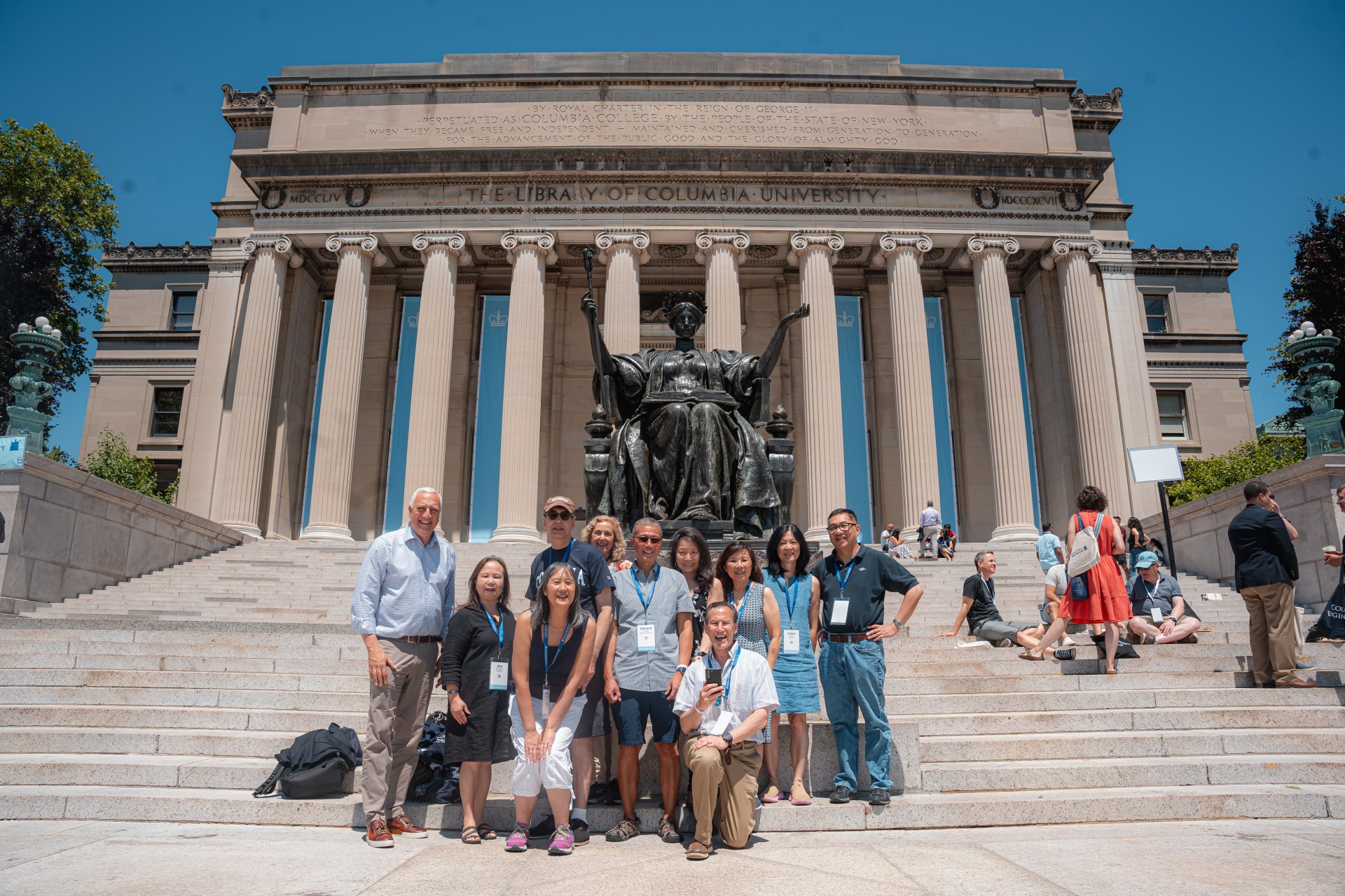 Alumni in front of Alma Mater
