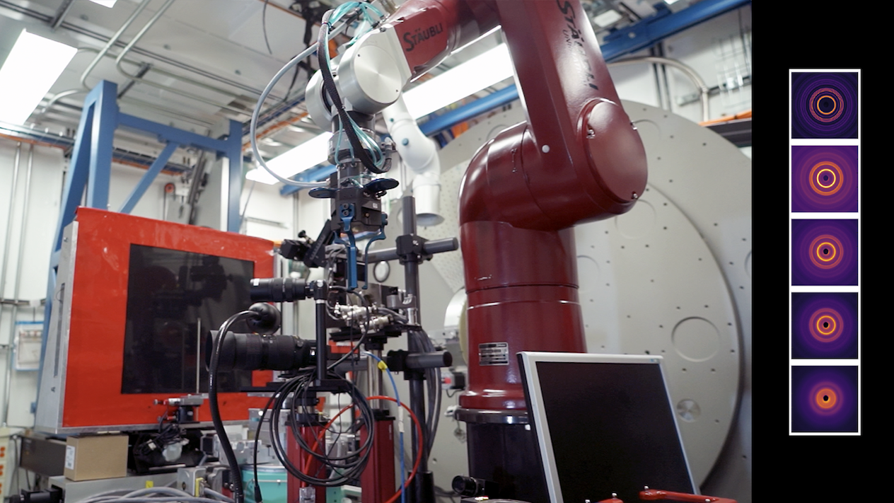 A complex machine with a camera lens. The right of the photo shows different diffraction patterns