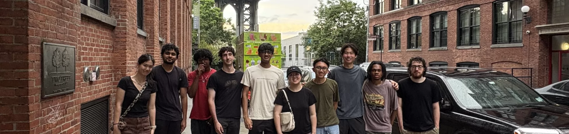 group of students standing in front of popular nyc tourist location in dumbo